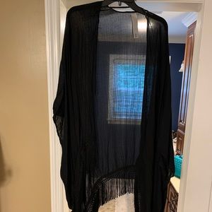 Black komino with fringe lining.